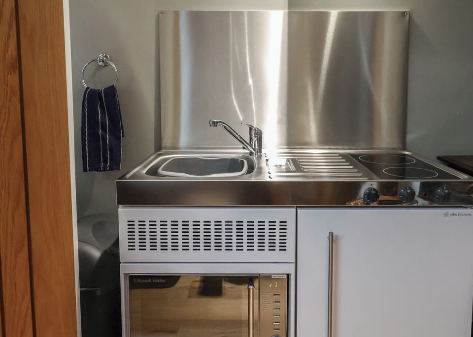 Fridge, electric kettle, toaster, cookware/dishes/utensils