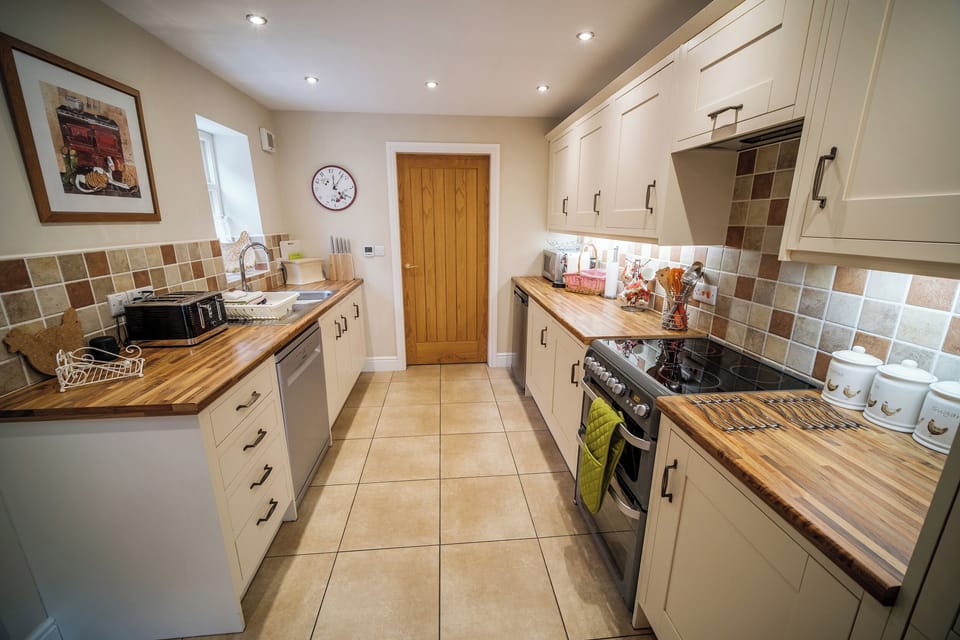 Fridge, electric kettle, toaster, cookware/dishes/utensils