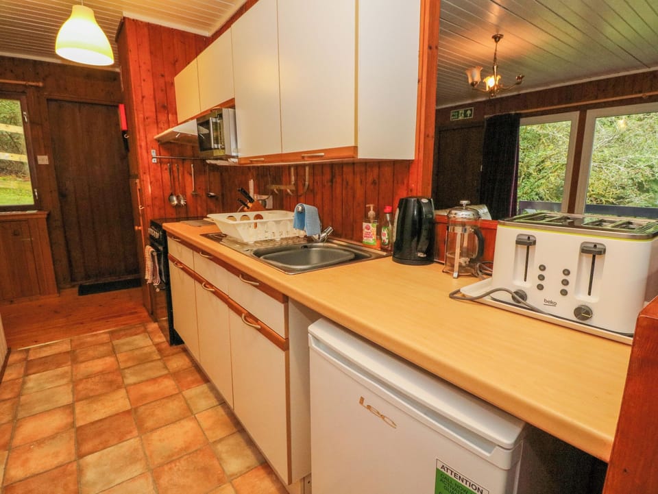 Fridge, electric kettle, toaster, cookware/dishes/utensils