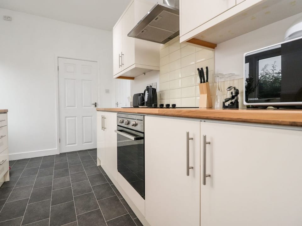 Fridge, electric kettle, toaster, cookware/dishes/utensils