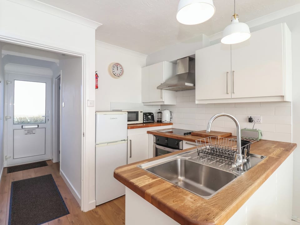 Fridge, electric kettle, toaster, cookware/dishes/utensils