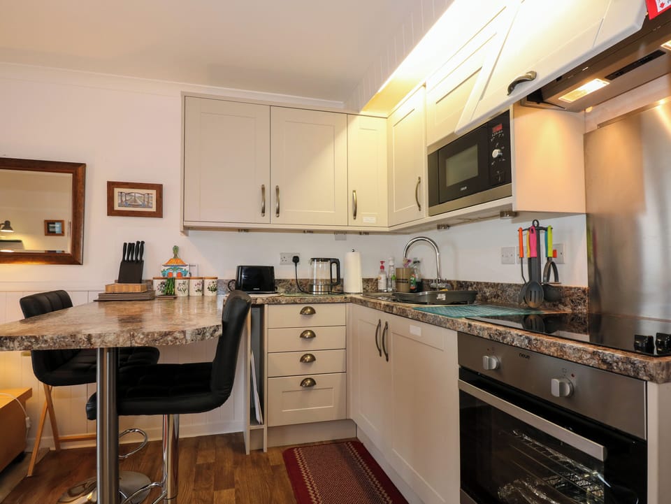 Fridge, electric kettle, toaster, cookware/dishes/utensils