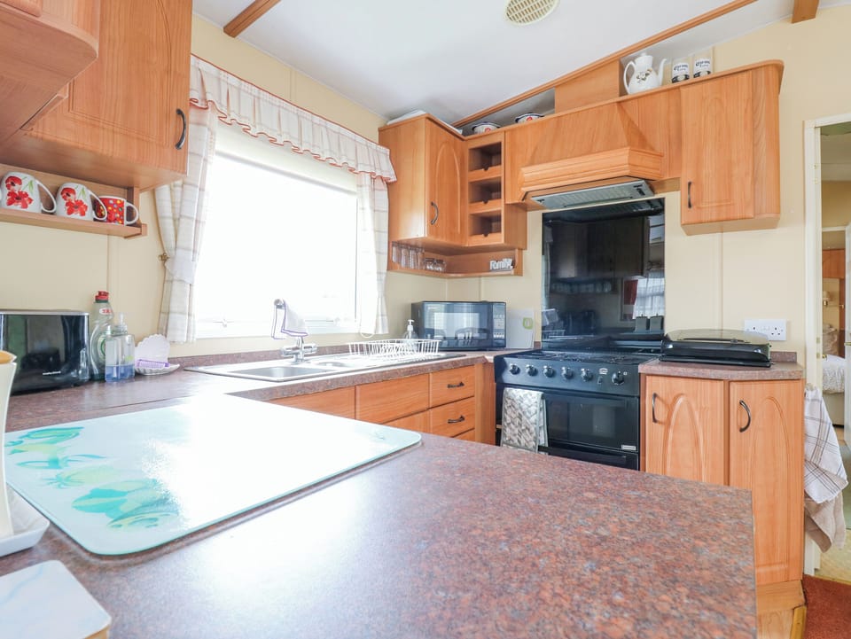 Fridge, electric kettle, toaster, cookware/dishes/utensils