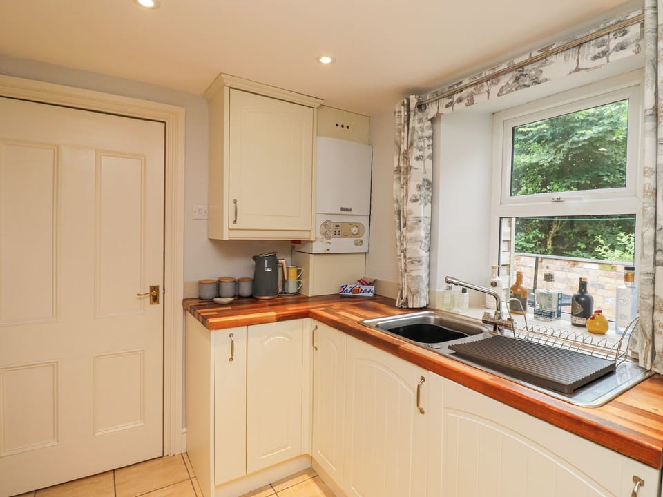 Fridge, electric kettle, cookware/dishes/utensils