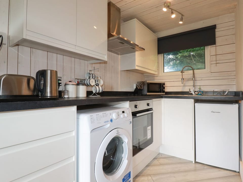 Fridge, electric kettle, toaster, cookware/dishes/utensils