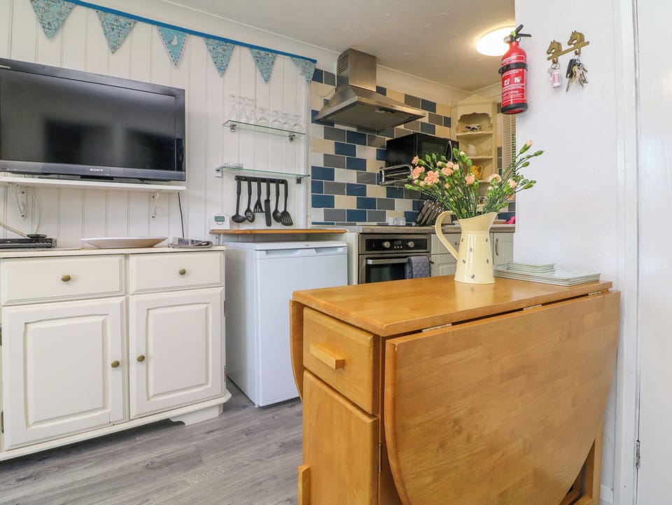 Fridge, electric kettle, toaster, cookware/dishes/utensils