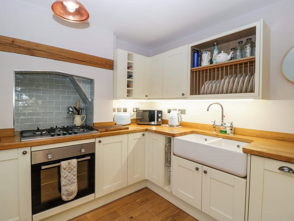 Fridge, electric kettle, toaster, cookware/dishes/utensils