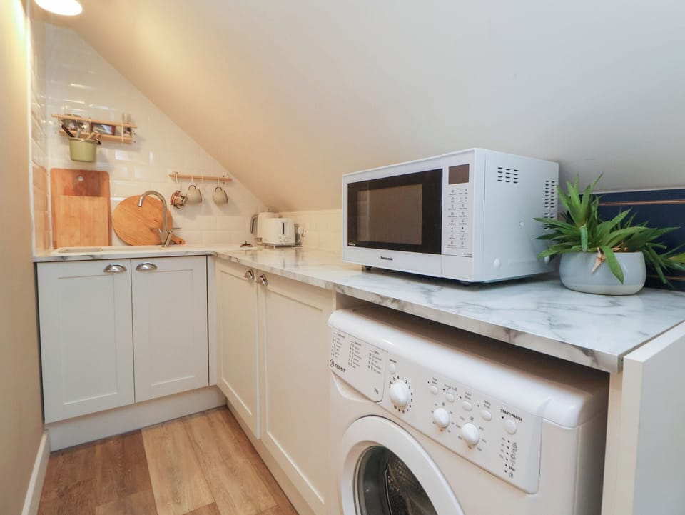 Fridge, electric kettle, cookware/dishes/utensils