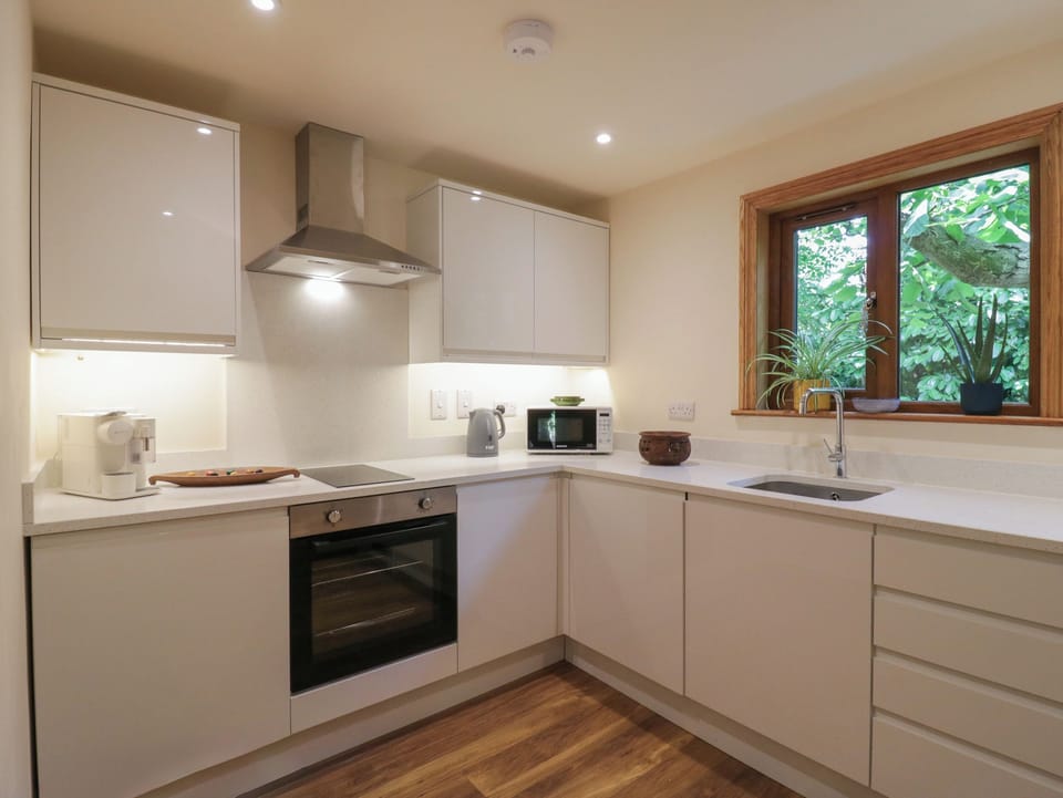 Fridge, electric kettle, cookware/dishes/utensils