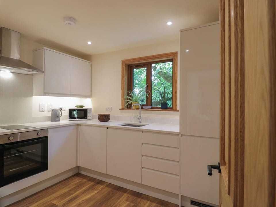 Fridge, electric kettle, cookware/dishes/utensils