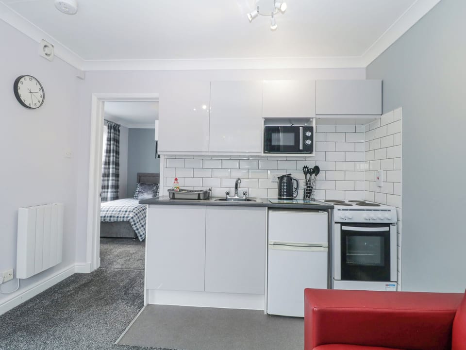 Fridge, electric kettle, toaster, cookware/dishes/utensils