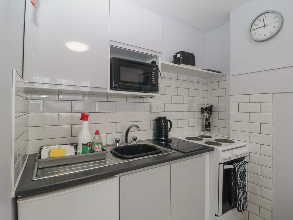 Fridge, electric kettle, toaster, cookware/dishes/utensils