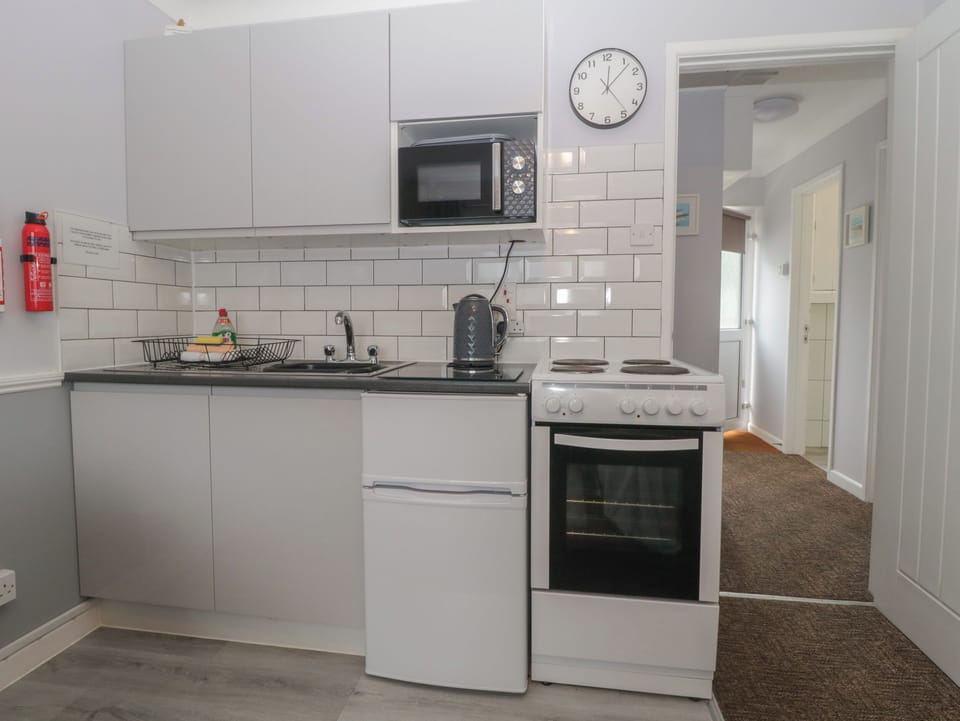 Fridge, electric kettle, toaster, cookware/dishes/utensils