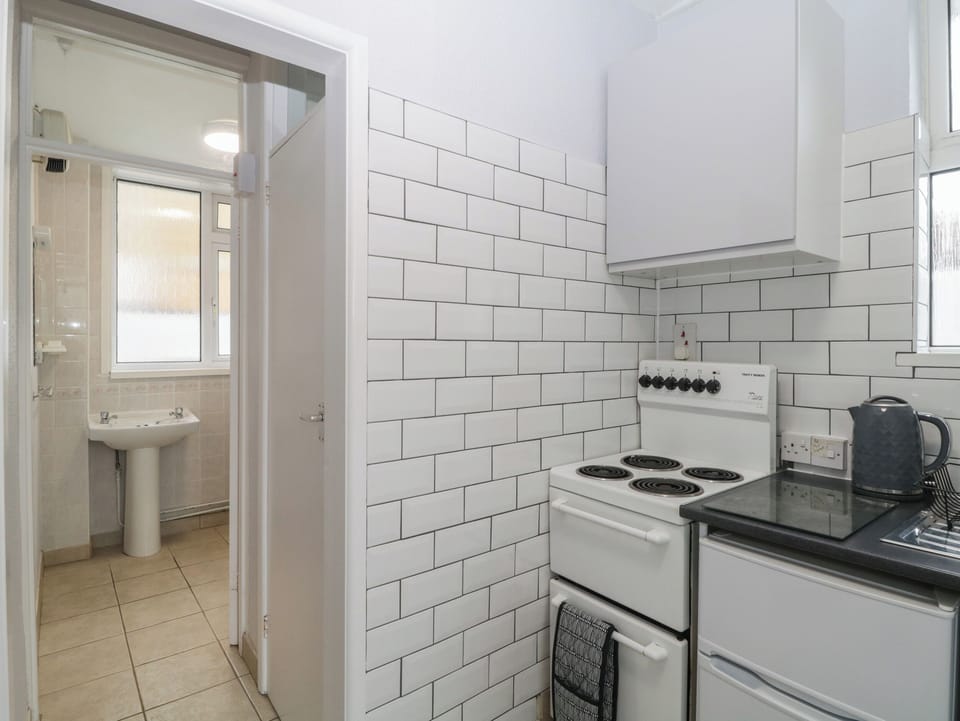 Fridge, electric kettle, toaster, cookware/dishes/utensils