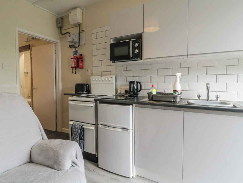 Fridge, electric kettle, toaster, cookware/dishes/utensils