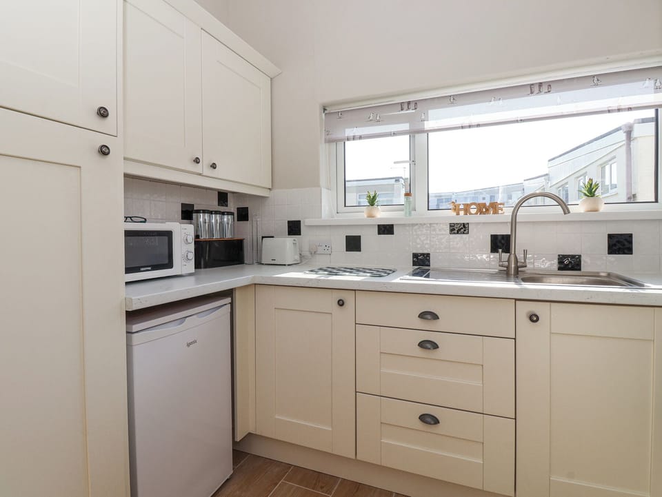 Fridge, microwave, toaster, cookware/dishes/utensils