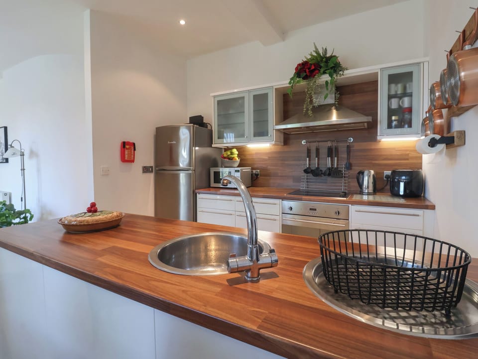 Fridge, electric kettle, cookware/dishes/utensils