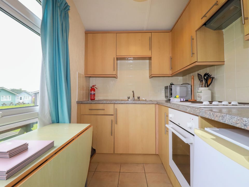 Fridge, electric kettle, cookware/dishes/utensils