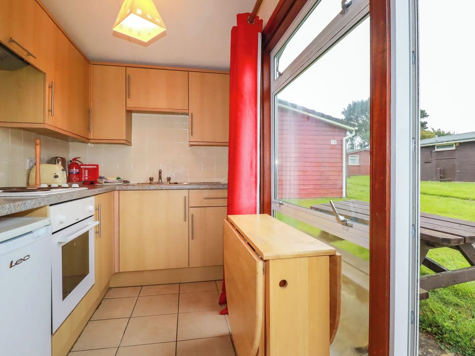 Fridge, electric kettle, cookware/dishes/utensils