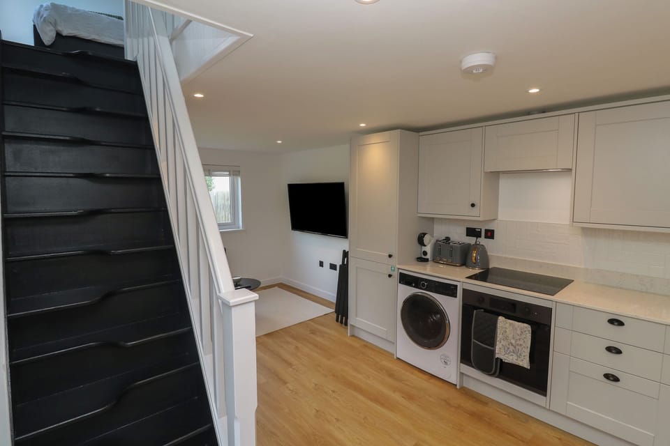 Fridge, electric kettle, toaster, cookware/dishes/utensils