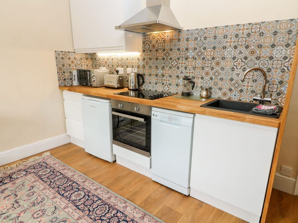 Fridge, dishwasher, electric kettle, cookware/dishes/utensils