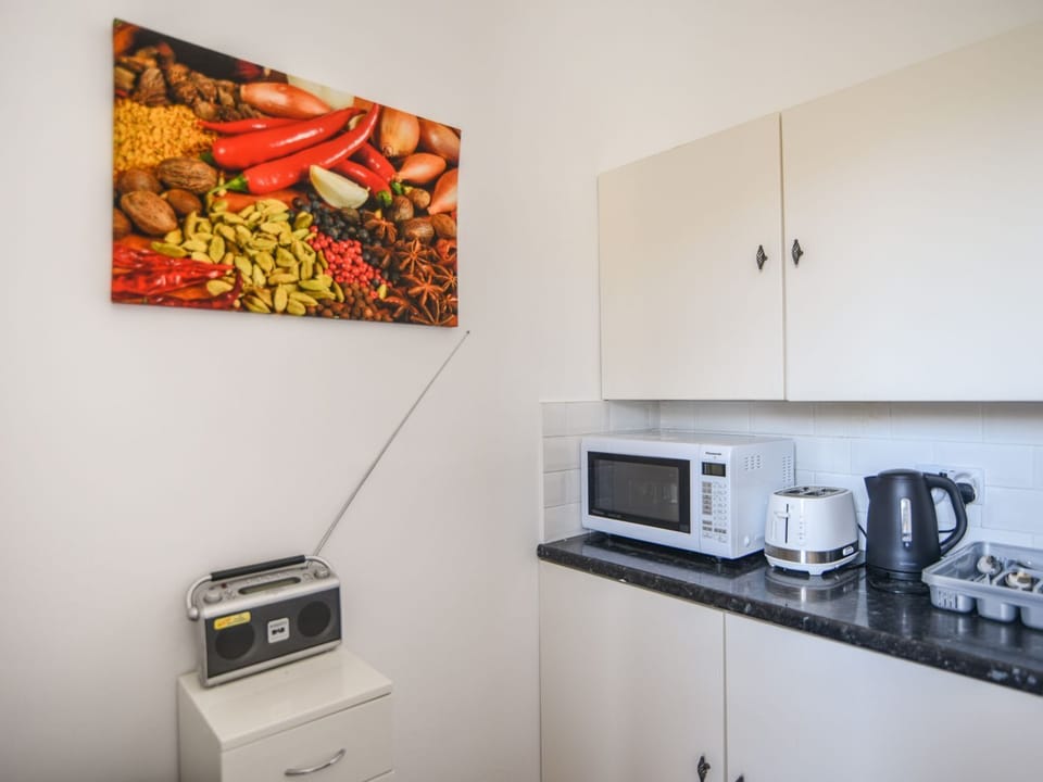 Fridge, electric kettle, toaster, cookware/dishes/utensils