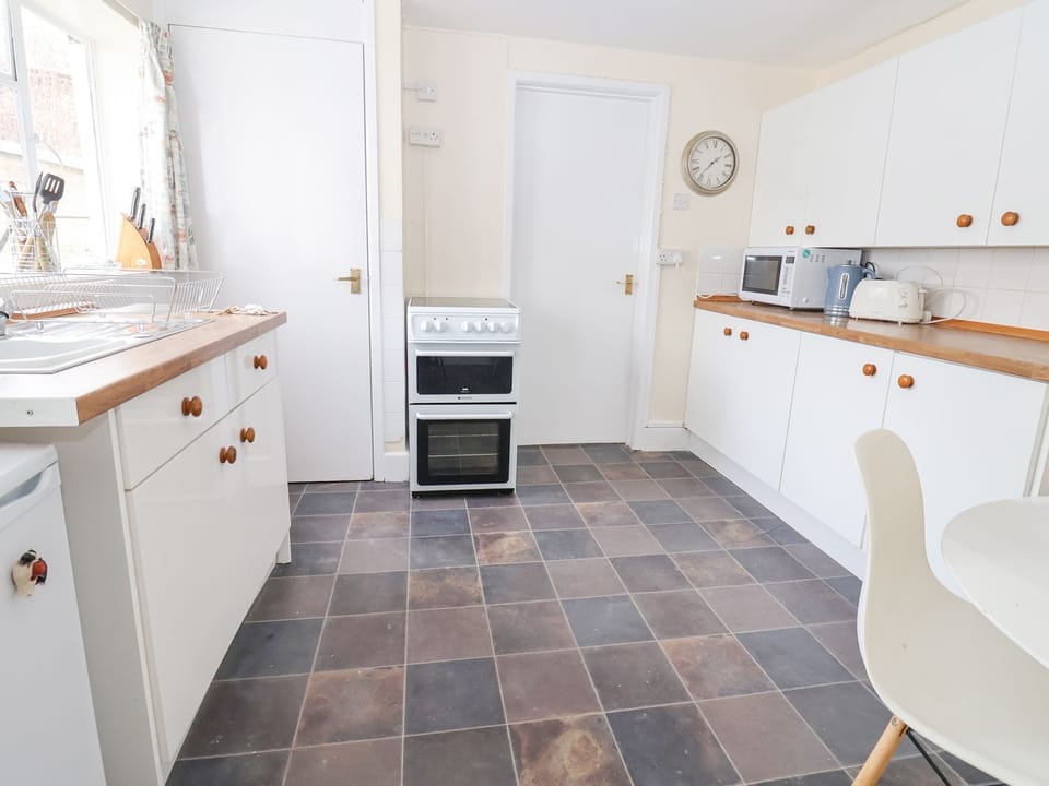 Fridge, electric kettle, toaster, cookware/dishes/utensils