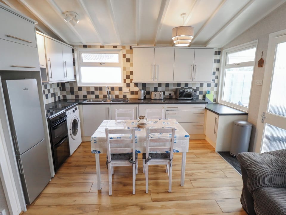 Fridge, electric kettle, toaster, cookware/dishes/utensils