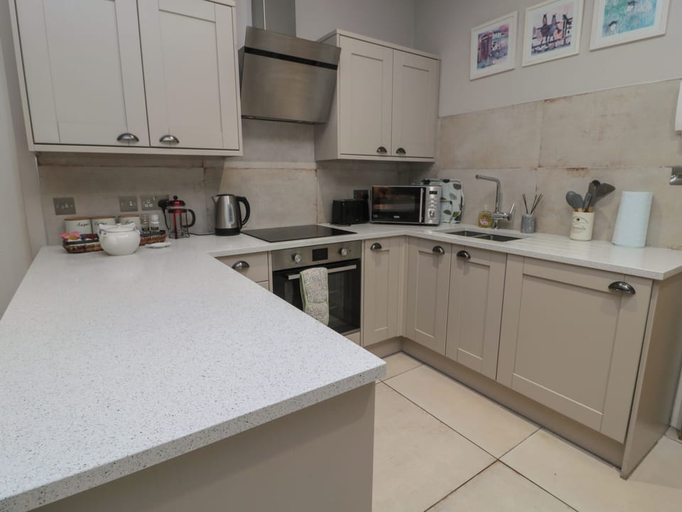 Fridge, electric kettle, cookware/dishes/utensils