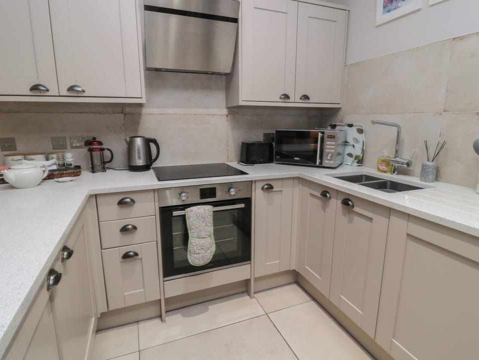 Fridge, electric kettle, cookware/dishes/utensils