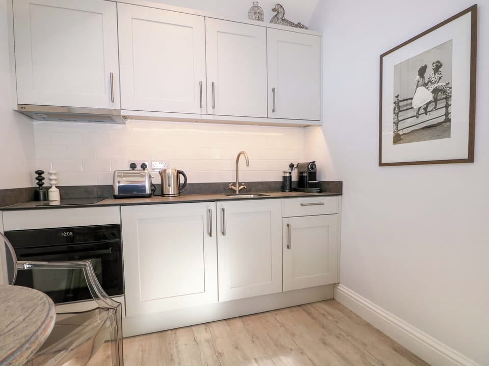 Fridge, electric kettle, toaster, cookware/dishes/utensils