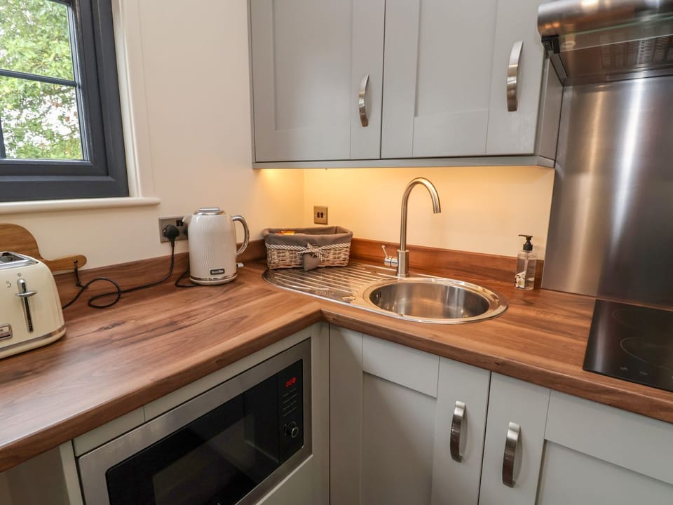 Fridge, electric kettle, toaster, cookware/dishes/utensils