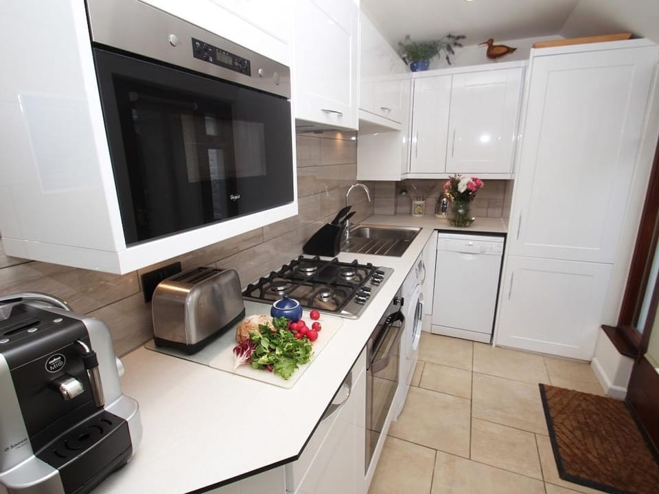 Fridge, dishwasher, electric kettle, cookware/dishes/utensils