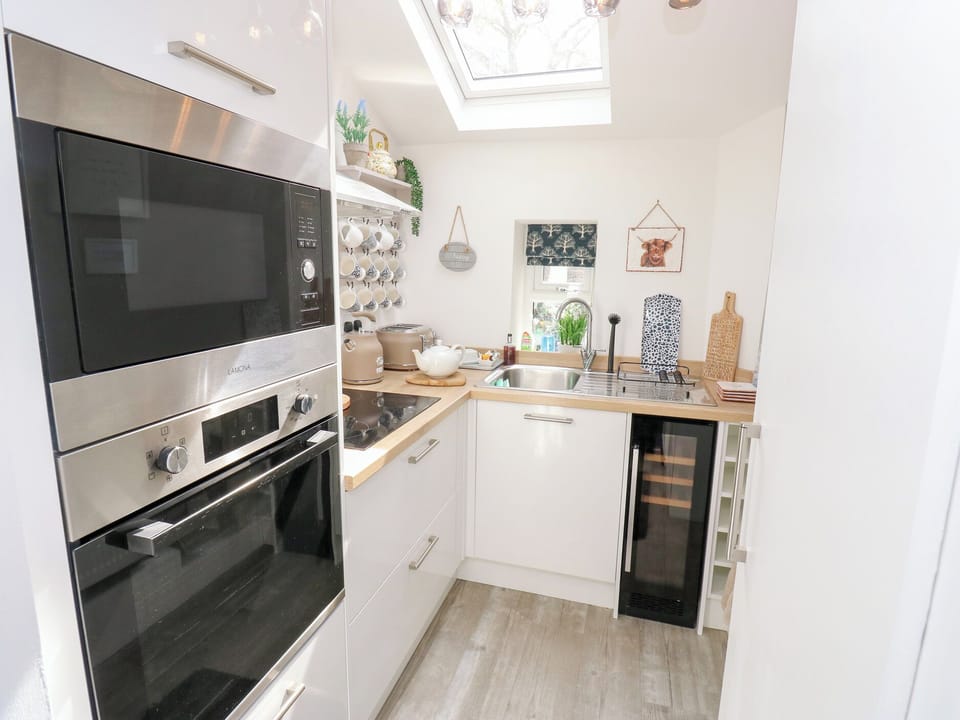 Fridge, electric kettle, toaster, cookware/dishes/utensils