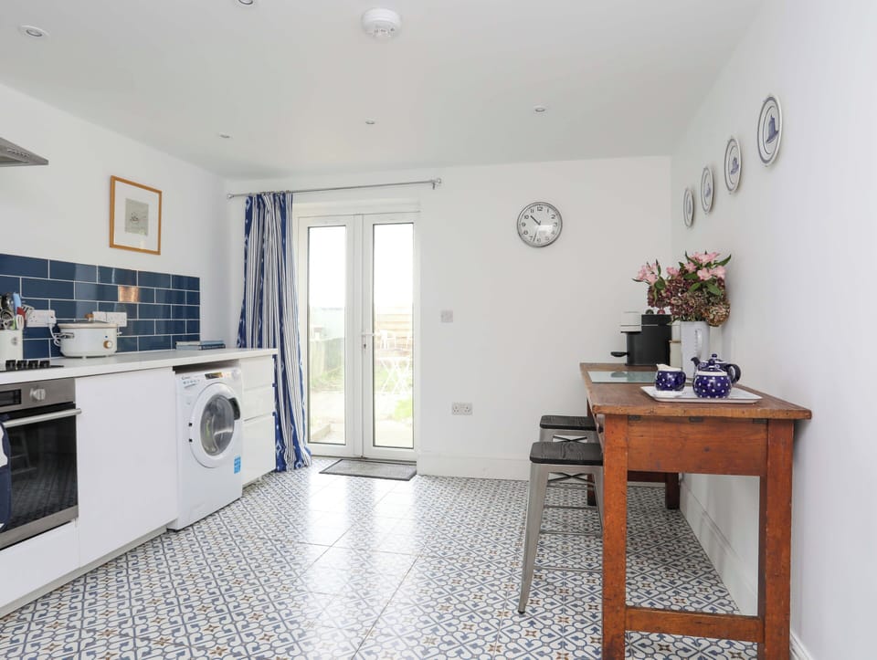 Fridge, electric kettle, toaster, cookware/dishes/utensils