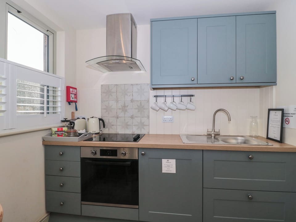 Fridge, electric kettle, toaster, cookware/dishes/utensils