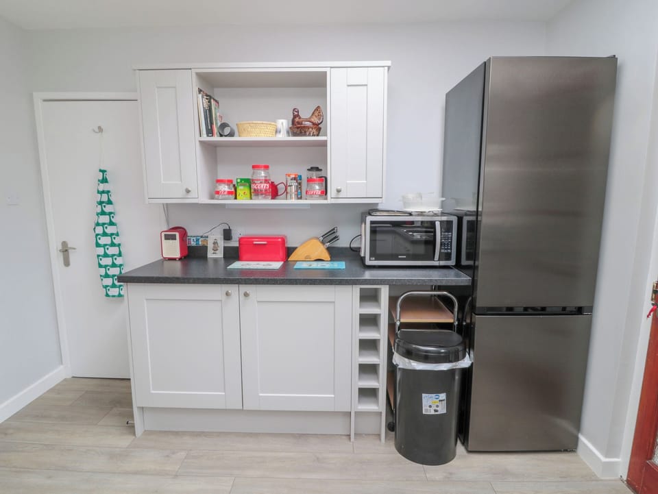 Fridge, electric kettle, toaster, cookware/dishes/utensils