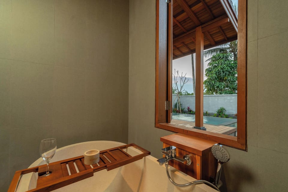 Luxury Villa, Pool View | Bathroom | Separate tub and shower, hair dryer, bathrobes, slippers