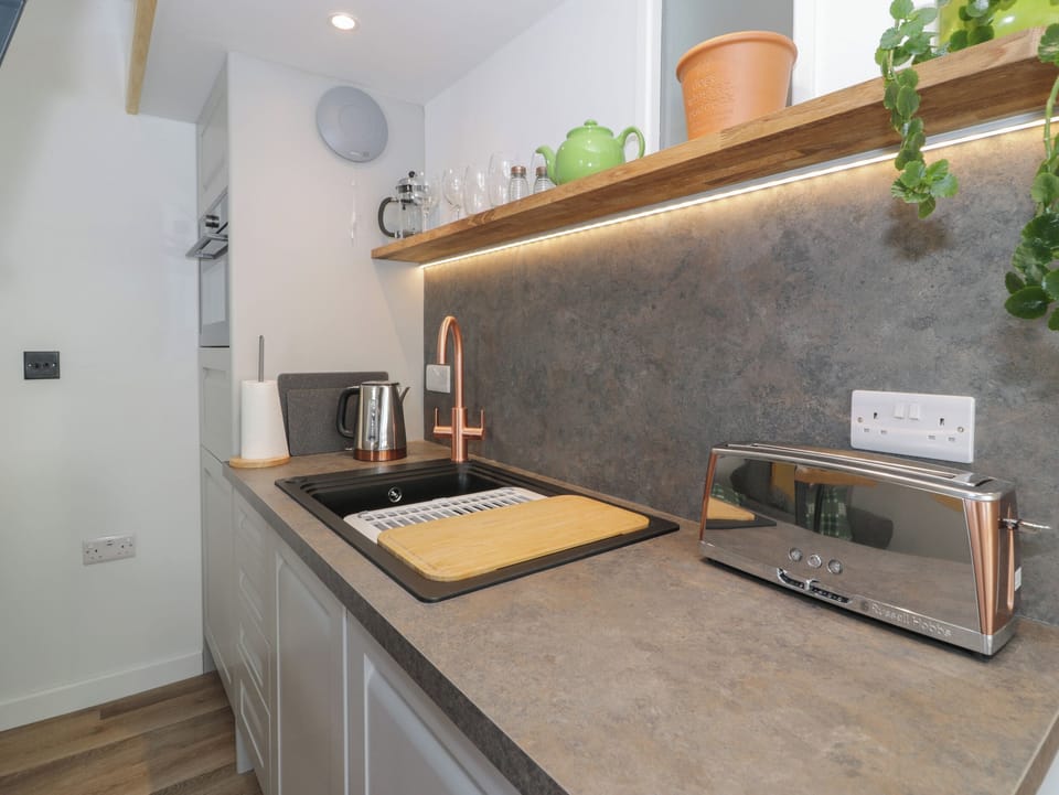 Fridge, electric kettle, toaster, cookware/dishes/utensils