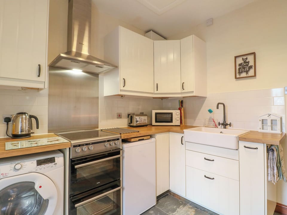 Fridge, electric kettle, toaster, cookware/dishes/utensils