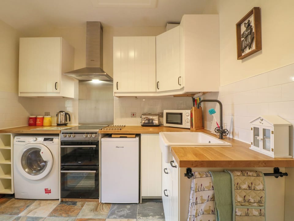 Fridge, electric kettle, toaster, cookware/dishes/utensils