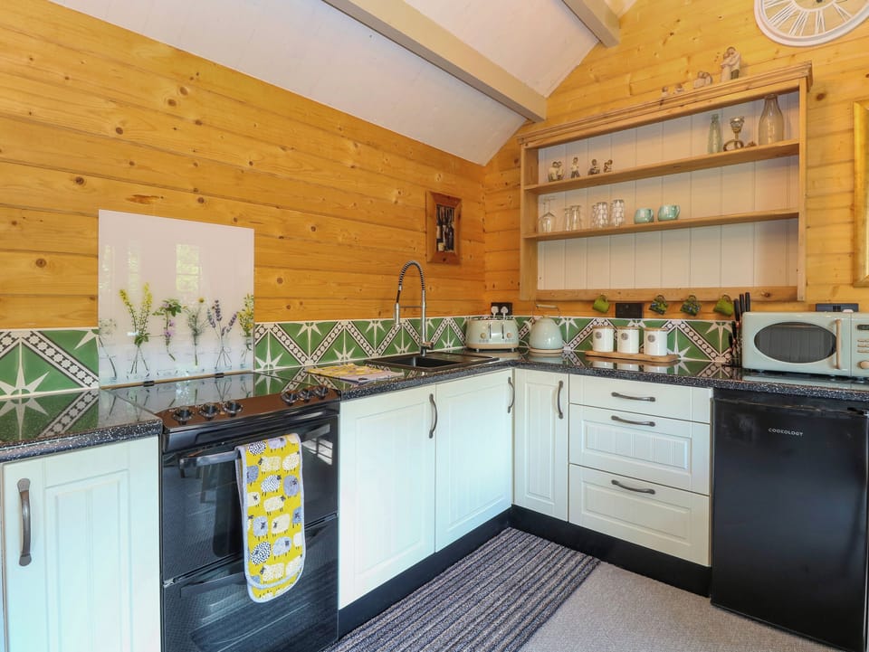 Fridge, electric kettle, cookware/dishes/utensils