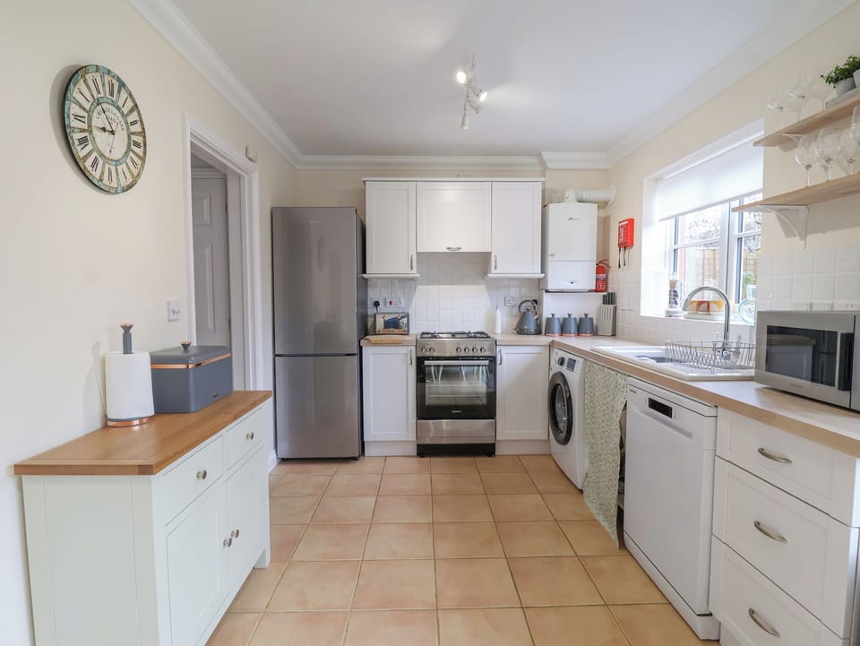Fridge, dishwasher, electric kettle, cookware/dishes/utensils