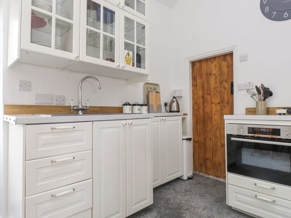 Fridge, electric kettle, toaster, cookware/dishes/utensils