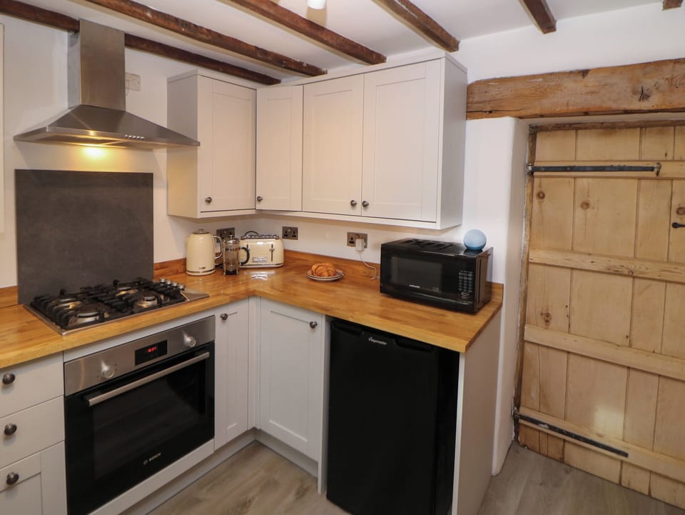 Fridge, electric kettle, toaster, cookware/dishes/utensils