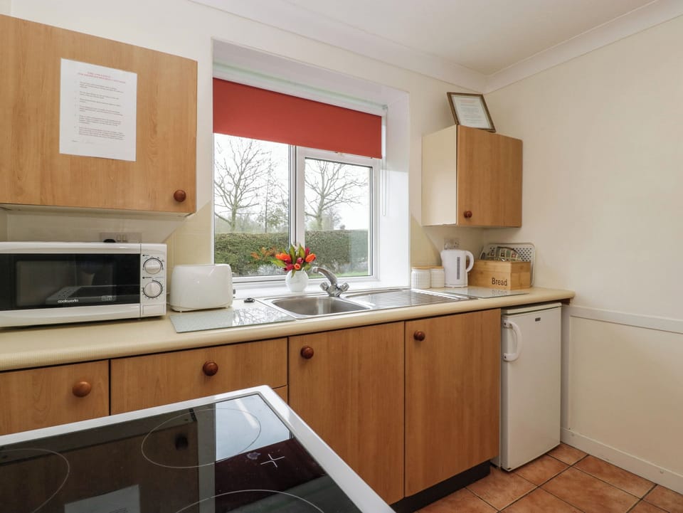 Fridge, electric kettle, toaster, cookware/dishes/utensils