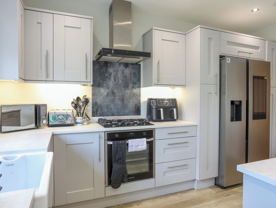 Fridge, electric kettle, toaster, cookware/dishes/utensils