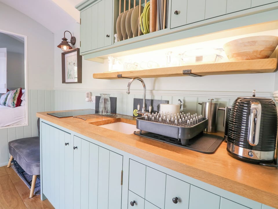 Fridge, electric kettle, toaster, cookware/dishes/utensils
