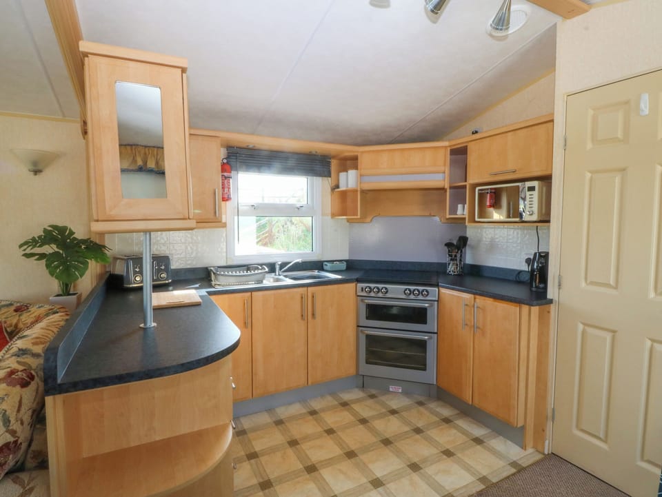 Fridge, electric kettle, toaster, cookware/dishes/utensils