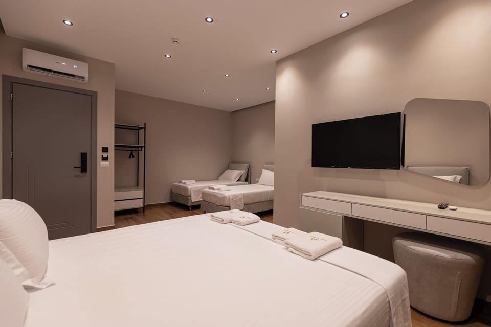 Deluxe Quadruple Room, Ground Floor | Desk, soundproofing, free WiFi